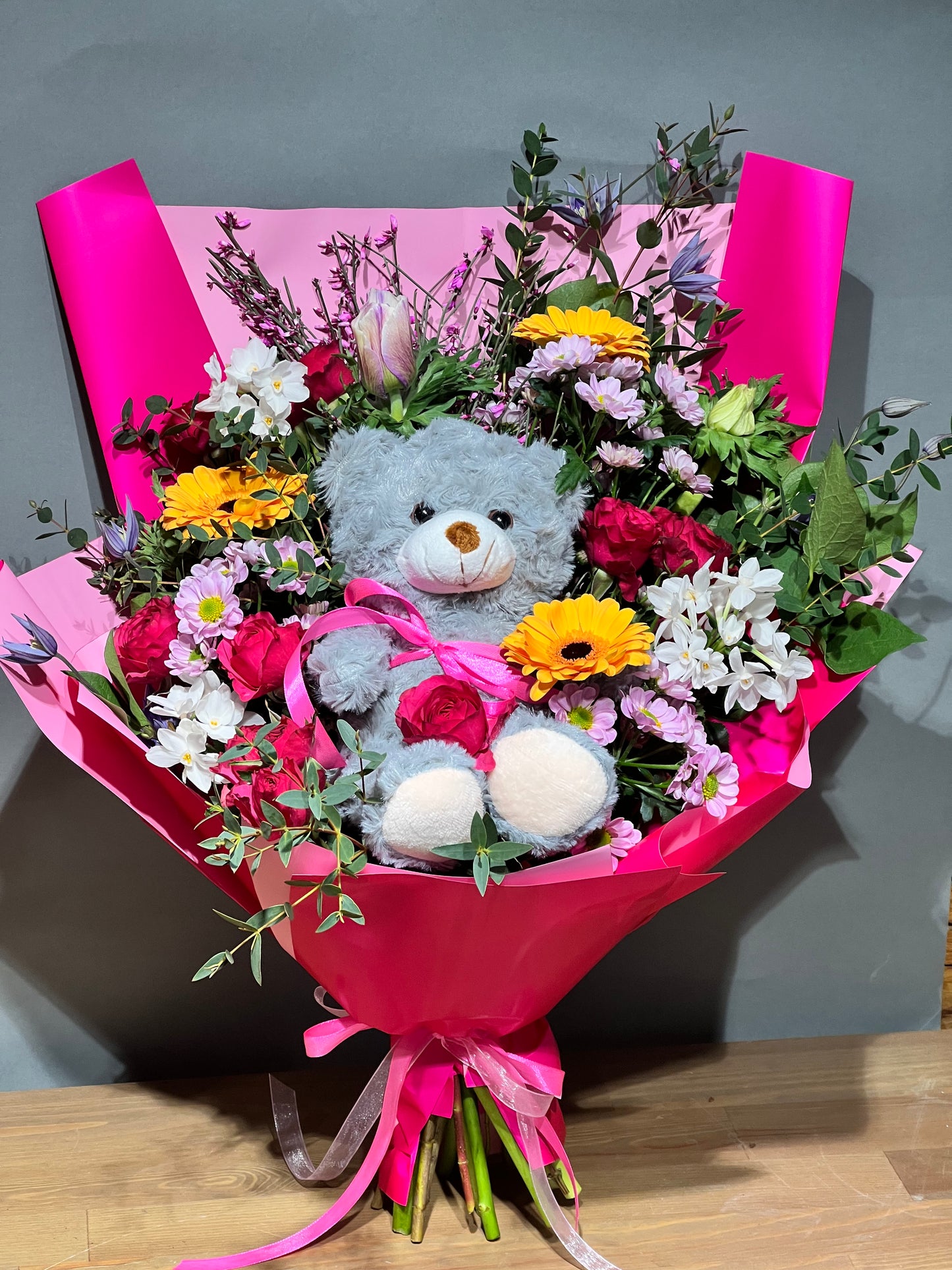 colorful flower bouquet with bear