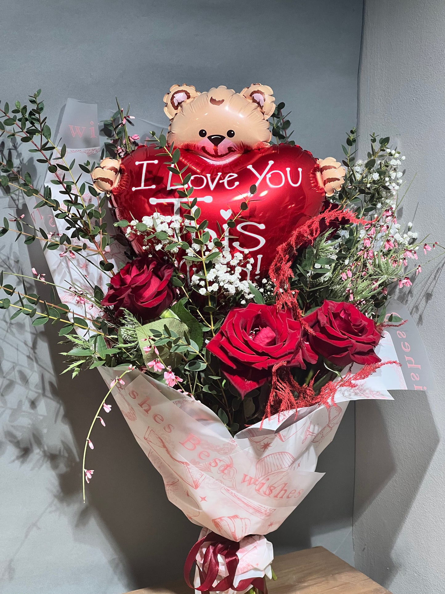 Flower bouquet with balloon heart